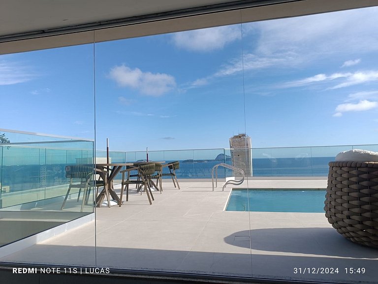 Apartment pool and balcony overlooking the sea and Christ