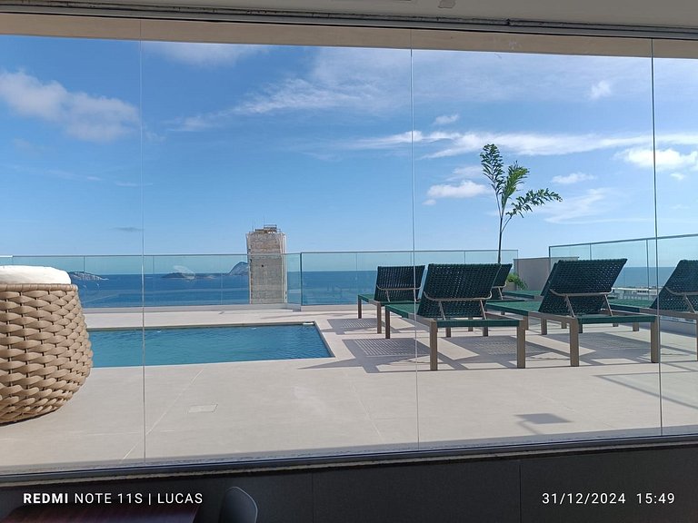 Apartment pool and balcony overlooking the sea and Christ